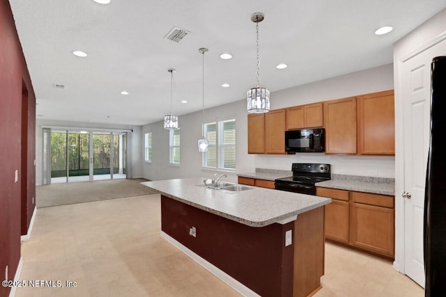 kitchen featuring visible vents, recessed lighting, a sink, black appliances, and light countertops