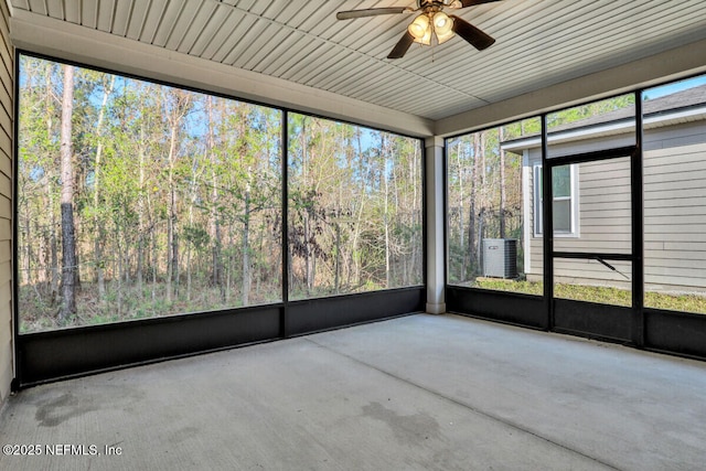 unfurnished sunroom featuring a ceiling fan