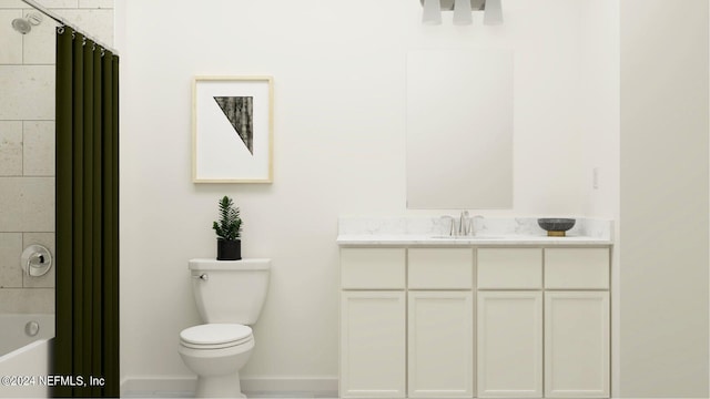 bathroom featuring vanity, toilet, baseboards, and shower / bath combo