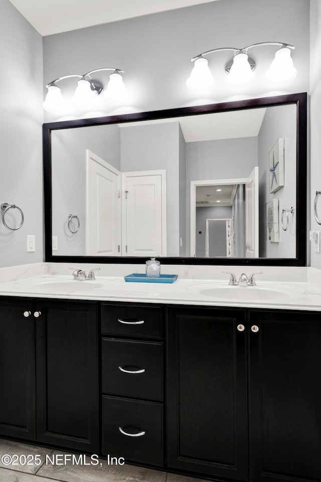 bathroom featuring double vanity and a sink