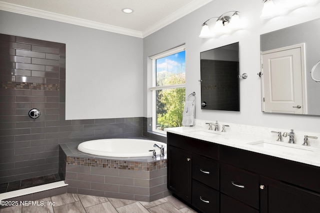 full bathroom featuring double vanity, a sink, ornamental molding, and a garden tub