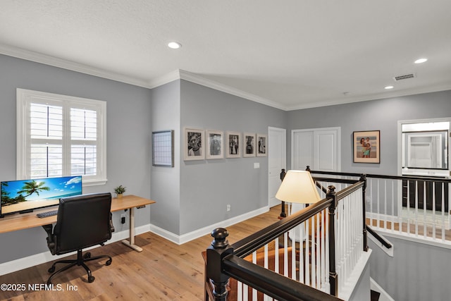 office featuring visible vents, baseboards, ornamental molding, wood finished floors, and recessed lighting