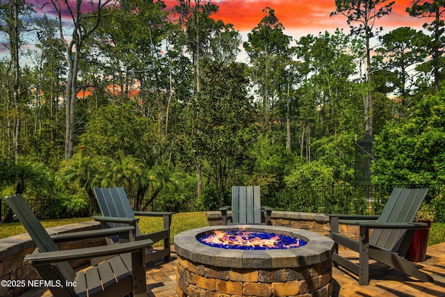 view of patio / terrace featuring an outdoor fire pit