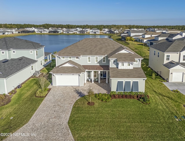 aerial view with a residential view and a water view