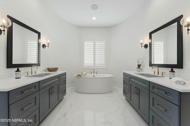 full bathroom featuring a sink, two vanities, and marble finish floor