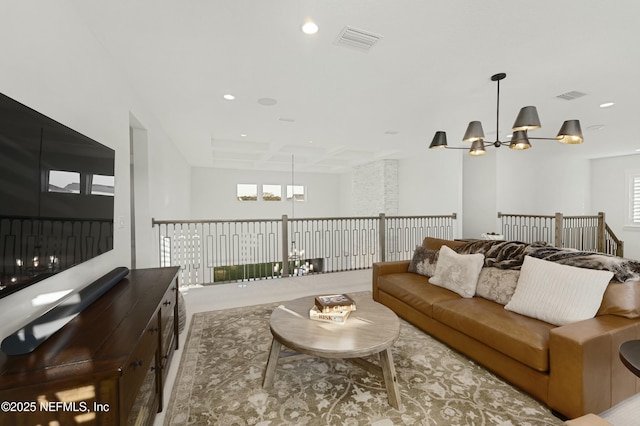 living area featuring a notable chandelier, recessed lighting, carpet, and visible vents