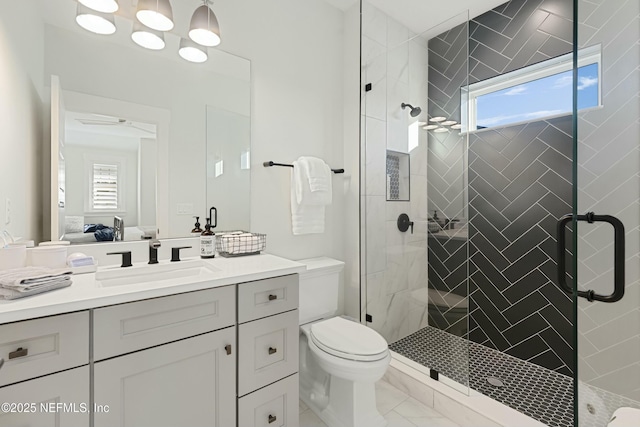 full bath with a wealth of natural light, connected bathroom, toilet, and a shower stall