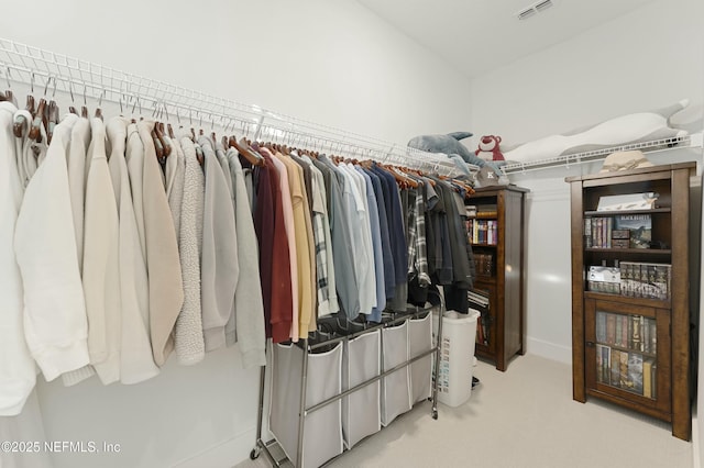 spacious closet featuring visible vents and carpet