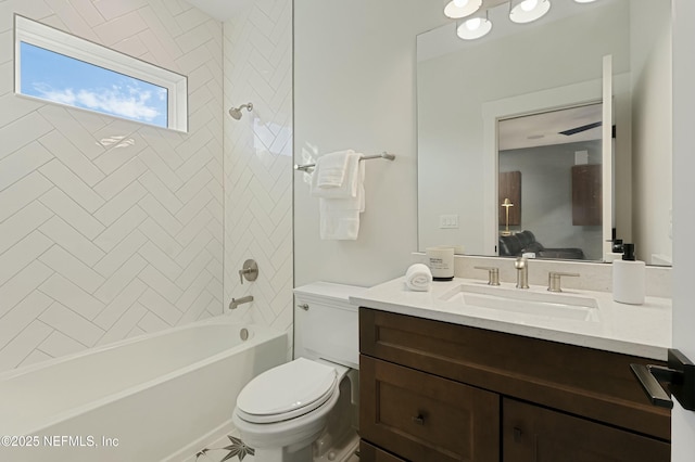 ensuite bathroom featuring vanity, ensuite bath, toilet, and shower / tub combination