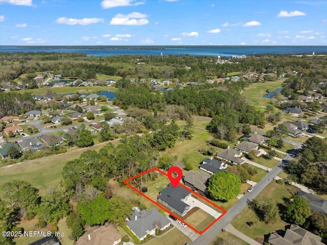 birds eye view of property with a residential view and a water view