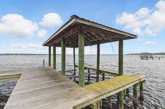 view of dock with a water view