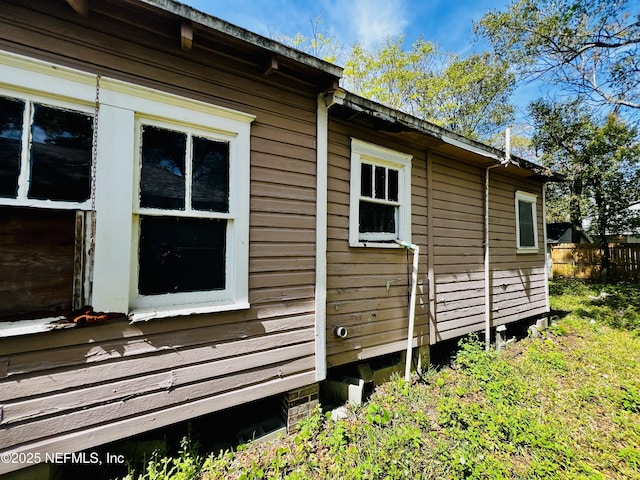 view of home's exterior with fence