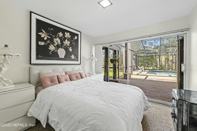 bedroom with access to exterior and a sunroom