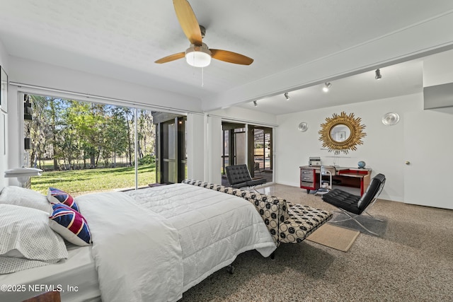 bedroom with speckled floor, baseboards, and access to outside