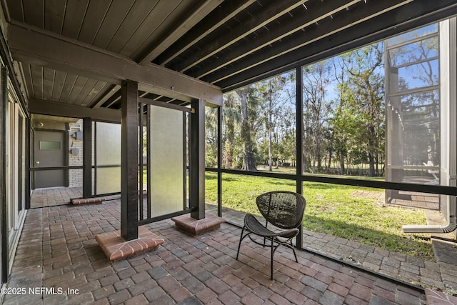 unfurnished sunroom with a wealth of natural light