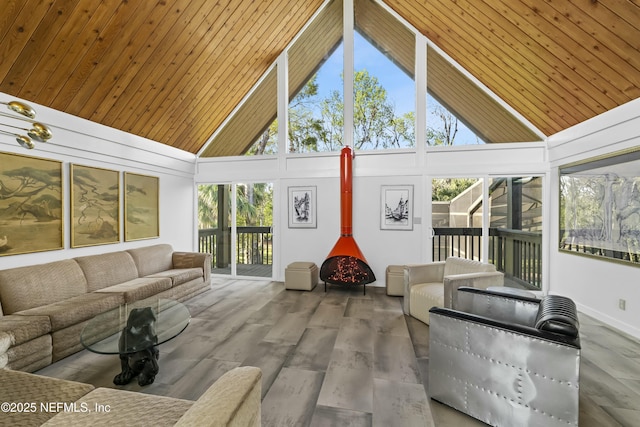 sunroom with wooden ceiling and vaulted ceiling