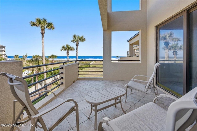 balcony featuring a water view