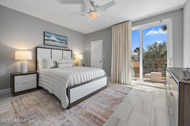 bedroom featuring access to exterior, baseboards, and ceiling fan