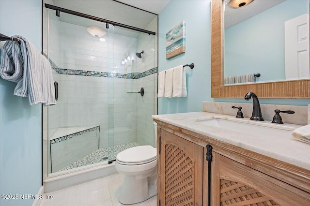 full bath featuring vanity, toilet, a shower stall, and tile patterned flooring