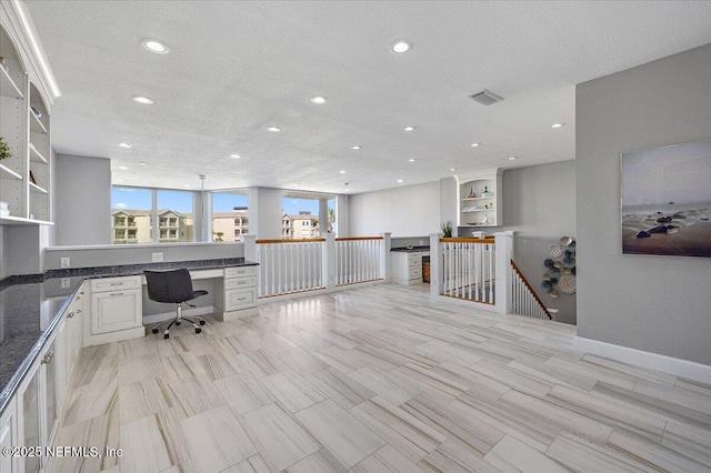 office space featuring built in study area, recessed lighting, visible vents, and a textured ceiling