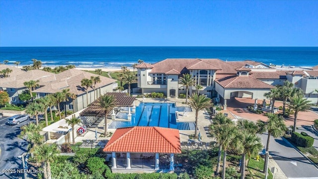 birds eye view of property with a residential view and a water view