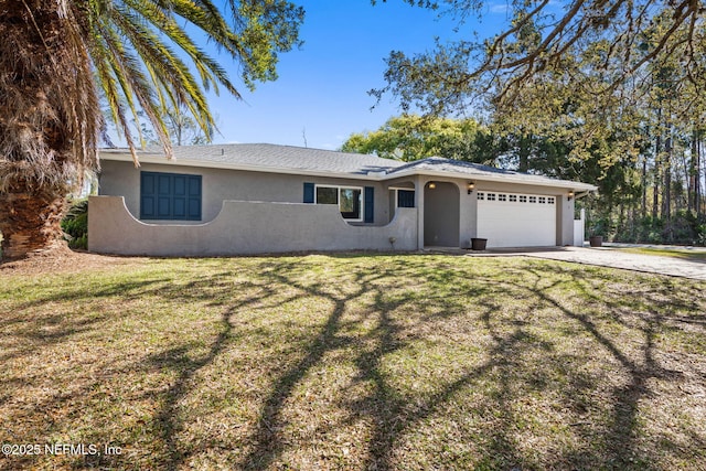 single story home with a front yard, an attached garage, driveway, and stucco siding