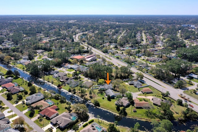 birds eye view of property featuring a residential view and a water view