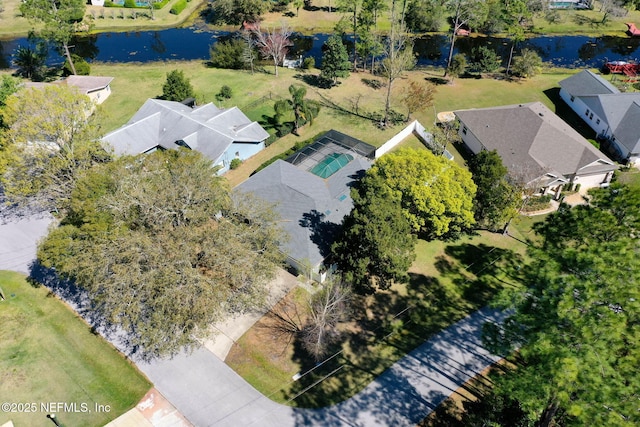 birds eye view of property with a residential view and a water view