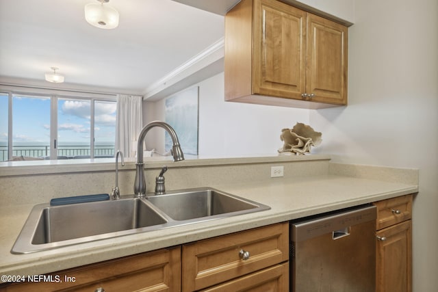 kitchen with dishwasher, light countertops, brown cabinets, and a sink