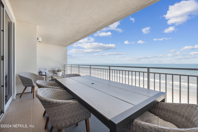 balcony with a view of the beach and a water view