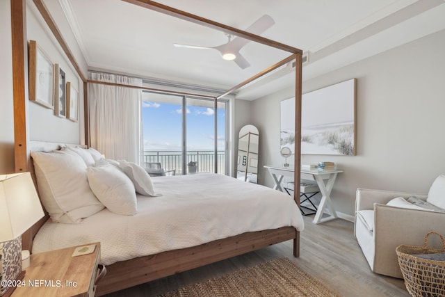 bedroom featuring visible vents, access to exterior, wood finished floors, crown molding, and ceiling fan