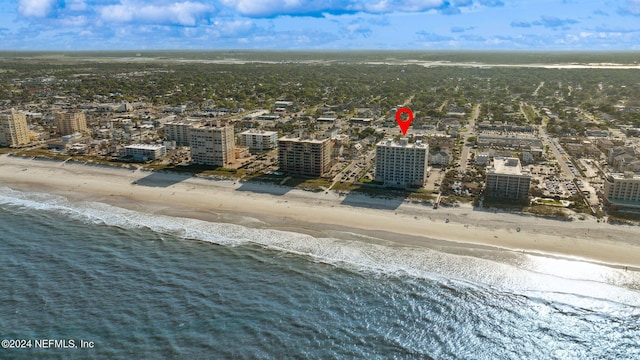 aerial view featuring a city view, a beach view, and a water view