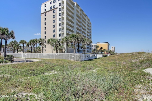 view of property with fence