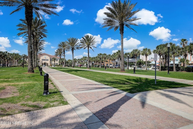 view of property's community featuring a residential view and a lawn