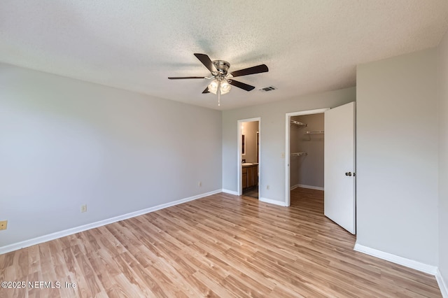 1602 Ibis Dr, Orange Park, FL 32065 - unfurnished bedroom featuring visible vents, baseboards, light wood-style flooring, a closet, and a textured ceiling