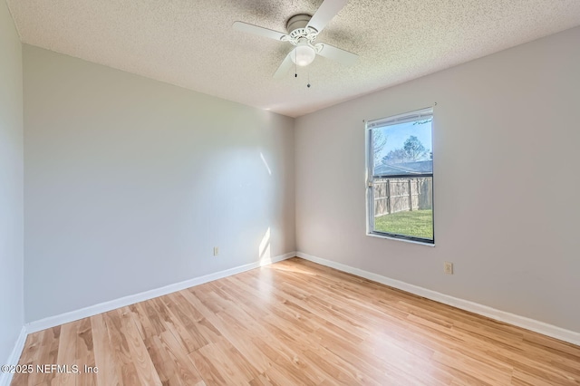 1602 Ibis Dr, Orange Park, FL 32065 - unfurnished room featuring a textured ceiling, baseboards, light wood-type flooring, and ceiling fan