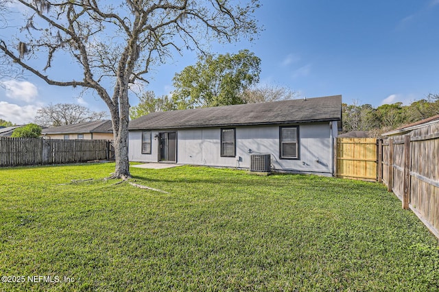 1602 Ibis Dr, Orange Park, FL 32065 - back of property featuring a yard, central AC, and a fenced backyard