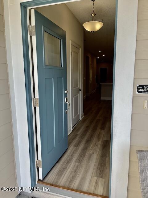 corridor with wood finished floors