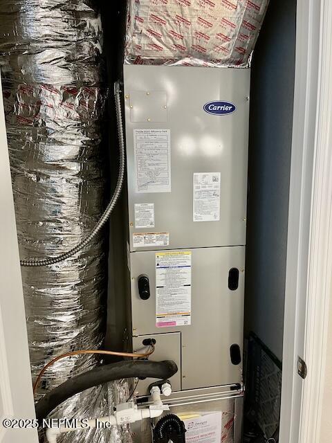 utility room with heating unit