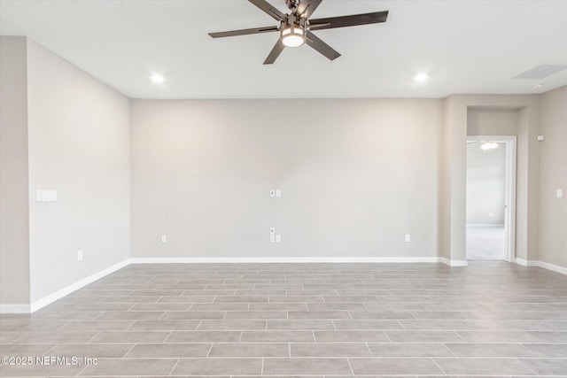 spare room with recessed lighting, baseboards, and ceiling fan