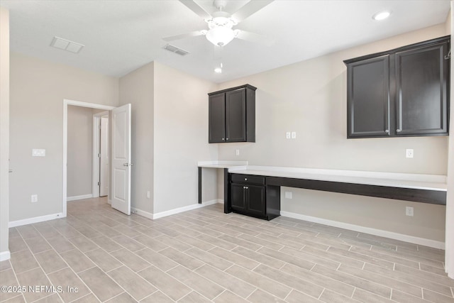 kitchen featuring light countertops, baseboards, visible vents, and ceiling fan