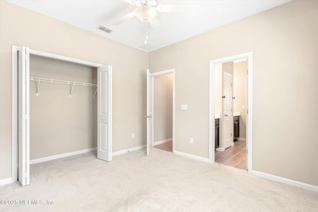 unfurnished bedroom with visible vents, ceiling fan, baseboards, carpet, and a closet