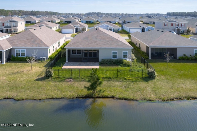 aerial view with a residential view and a water view