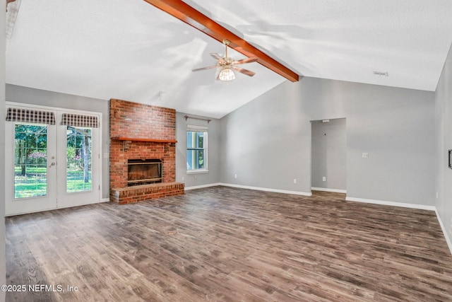 unfurnished living room featuring wood finished floors, baseboards, vaulted ceiling with beams, ceiling fan, and a textured ceiling