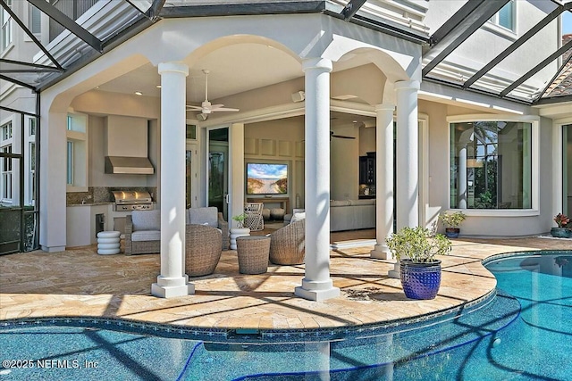 pool featuring a patio area, area for grilling, glass enclosure, and ceiling fan