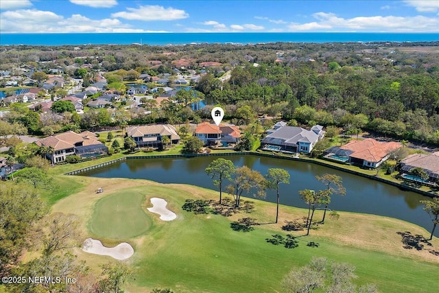 bird's eye view with view of golf course, a residential view, and a water view