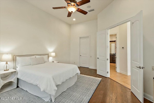 bedroom featuring visible vents, ceiling fan, baseboards, recessed lighting, and wood finished floors