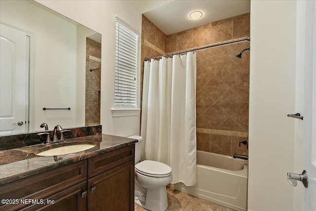 bathroom with vanity, toilet, and shower / tub combo with curtain