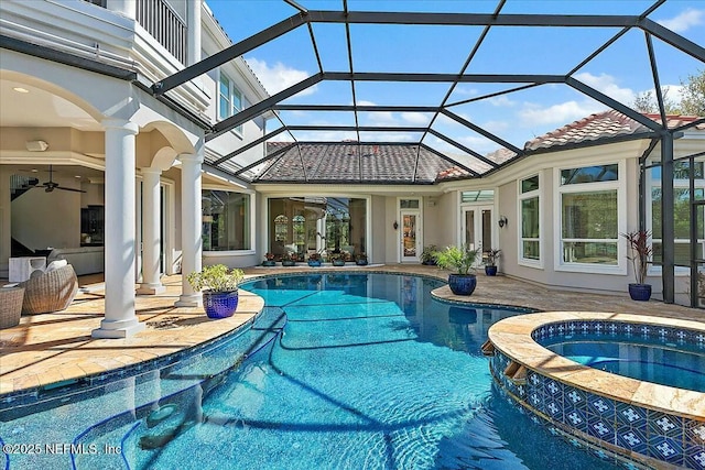 view of pool with a ceiling fan, a patio, french doors, and a pool with connected hot tub