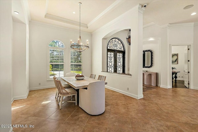 dining room featuring baseboards, a notable chandelier, light tile patterned flooring, and crown molding